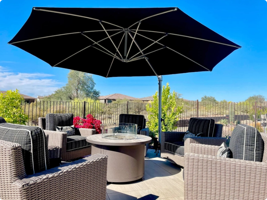 Commercial cantilever umbrella providing shade beside a professionally designed pool area